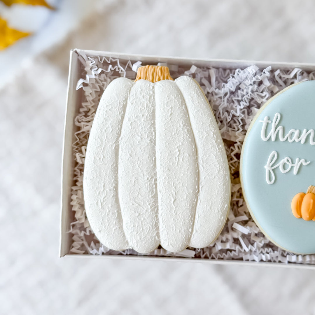 Decorated Thanksgiving cookie duo from Southern Sugar Bakery featuring thankful-themed designs on festive cookies.