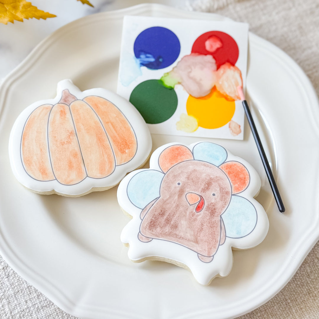 Fall-themed paint-your-own cookies duo from Southern Sugar Bakery featuring festive Thanksgiving designs for creative cookie decorating.
