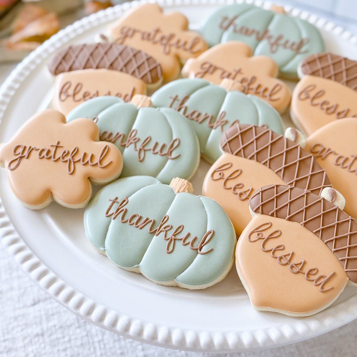 Decorated Thanksgiving cookie set featuring "Thankful," "Grateful," and "Blessed" messages from Southern Sugar Bakery.