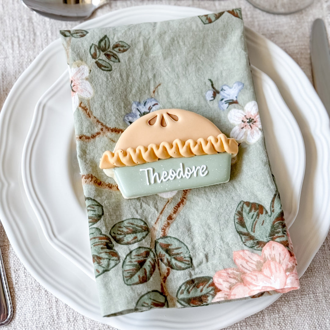 Decorated Thanksgiving cookie set with pie-themed place cards from Southern Sugar Bakery, featuring festive fall designs.