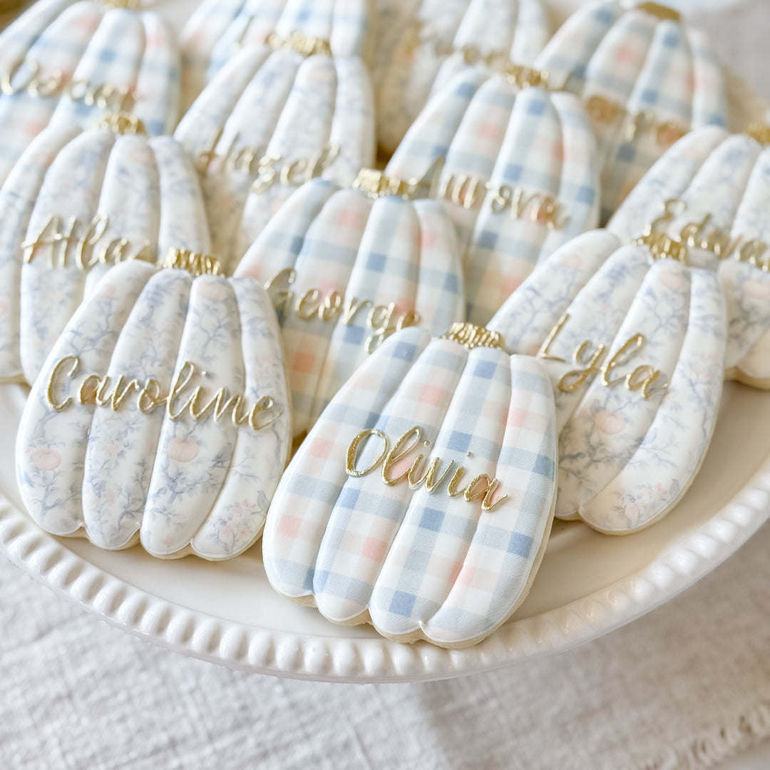 Thanksgiving pumpkin-themed decorated cookie set with place card designs from Southern Sugar Bakery.