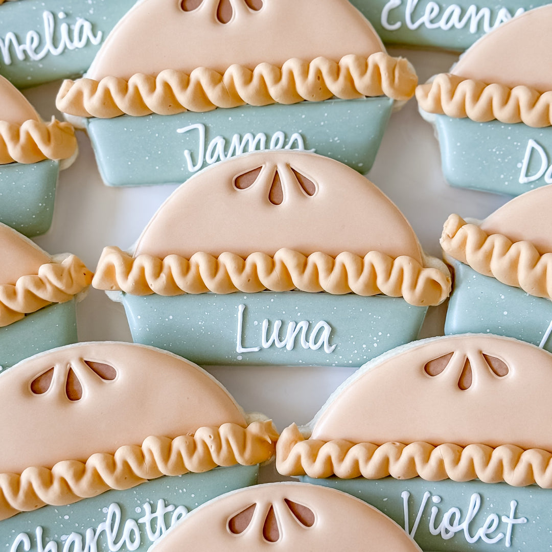 Decorated Thanksgiving cookie set with pie place cards from Southern Sugar Bakery, featuring festive autumn-themed cookie designs.