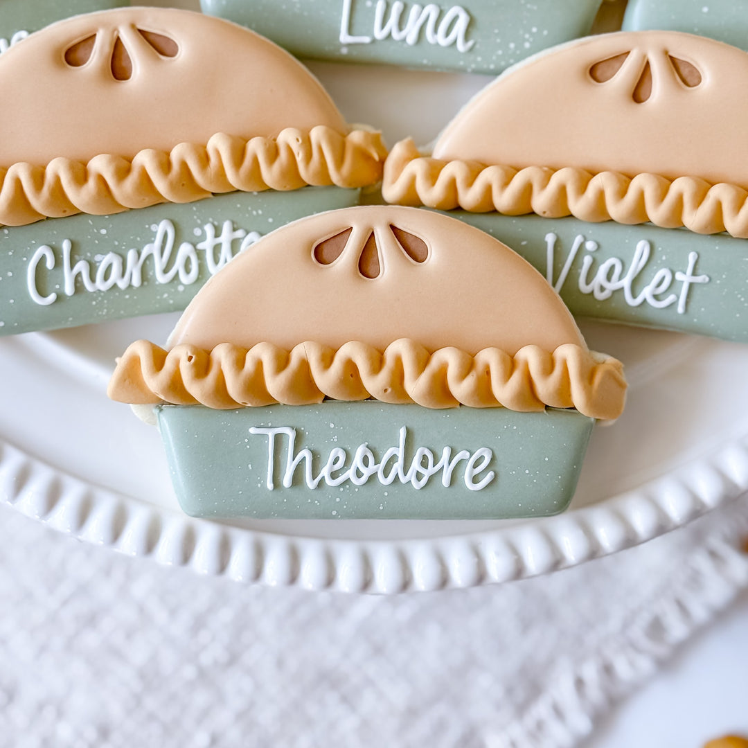 Decorated Thanksgiving cookie set with pie-themed place cards from Southern Sugar Bakery, featuring festive autumn designs.
