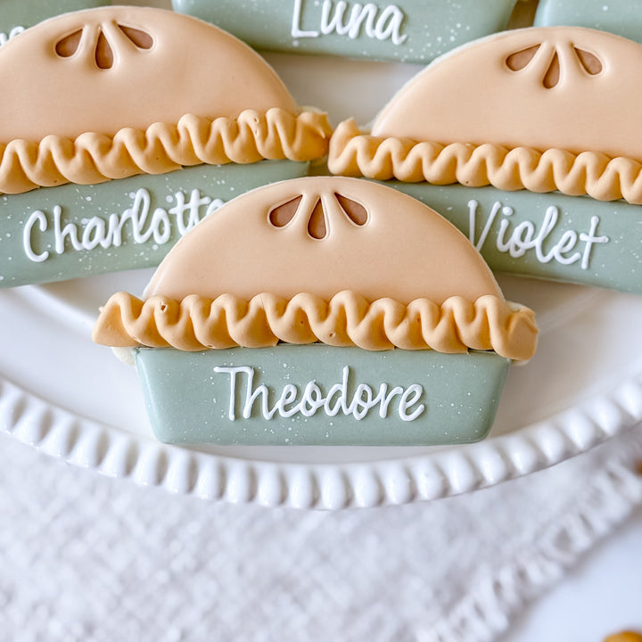 Decorated Thanksgiving cookie set with pie-themed place cards from Southern Sugar Bakery, featuring festive autumn designs.
